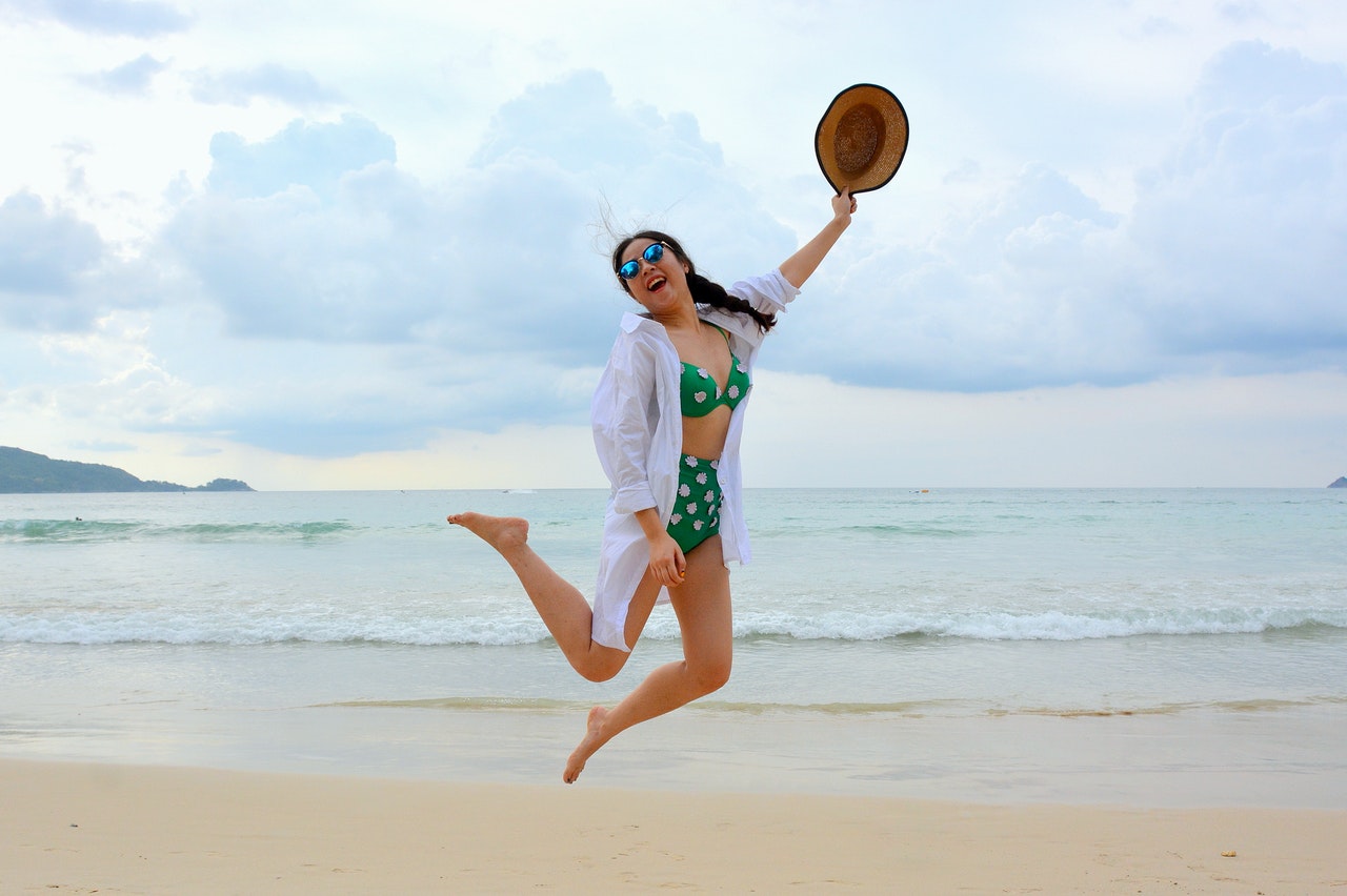 girl jumping on beach